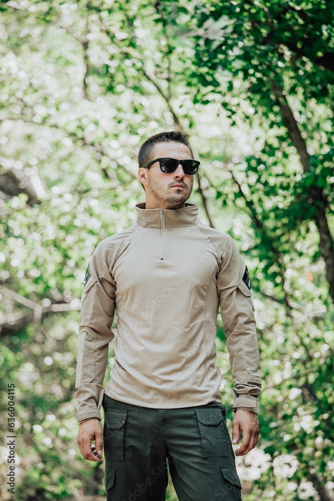 Male soldier in a military uniform standing with a neutral expression, ready for duty Male soldier in a military uniform standing with a neutral expression, ready for duty