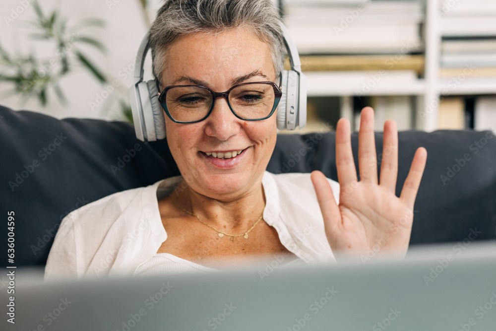 Happy senior woman is having a video call at home. Happy senior woman is having a video call at home.