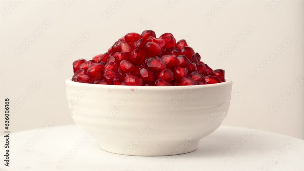 Close-up view of peeled pomegranate seeds in a small bowl Close-up view of peeled pomegranate seeds in a small bowl
