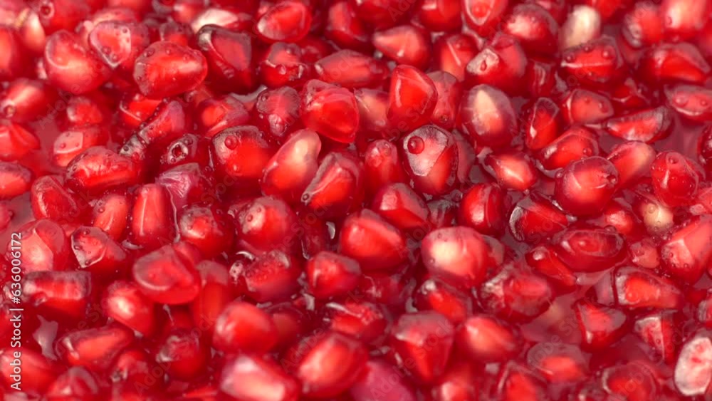 Close-up view of a handful of peeled pomegranate seeds Close-up view of a handful of peeled pomegranate seeds