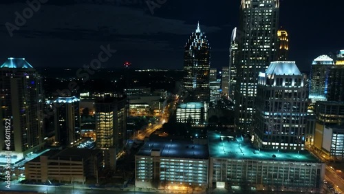 Wallpaper Mural Aerial Shot Of Illuminated Buildings Amidst Streets In City, Drone Flying Backward Over Modern Structures At Night - Atlanta, Georgia Torontodigital.ca