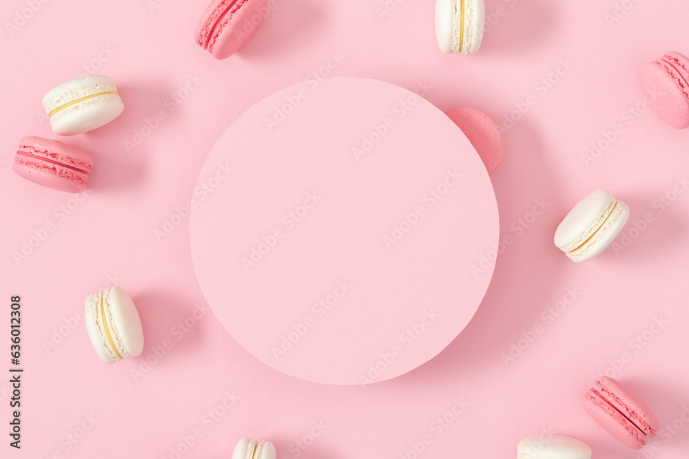 Cake macaroons or macaroon on pink background, round, circle for text , colorful almond cookies, macaroon for sweet break mock up. Flat lay, top view Cake macaroons or macaroon on pink background, round, circle for text , colorful almond cookies, macaroon for sweet break mock up. Flat lay, top view
