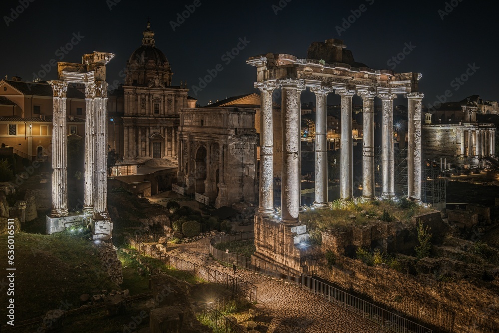 Aerial shot of the Roman Forum, at night in Rome, Italy.