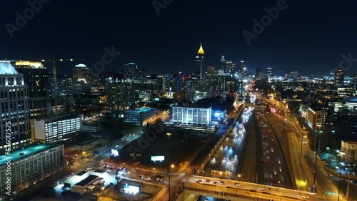 Wallpaper Mural Aerial Shot Of Illuminated Modern Buildings By Roads In City, Drone Flying Backward Over Vehicles - Atlanta, Georgia Torontodigital.ca