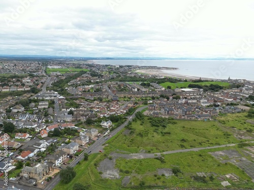 Aerial view of a residential area with lush green grass in Scotland