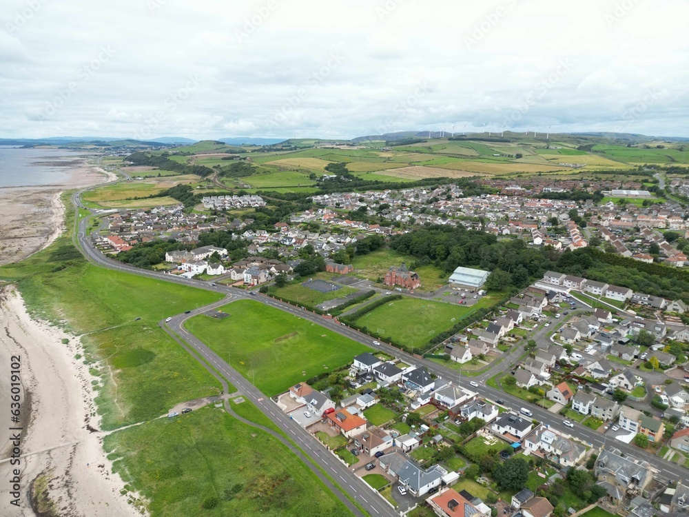 Aerial view of a residential area with lush green grass in Scotland