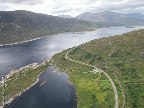 Aerial view of Loch Cluanie in the Highlands of Scotland, surrounded by verdant green hills photo