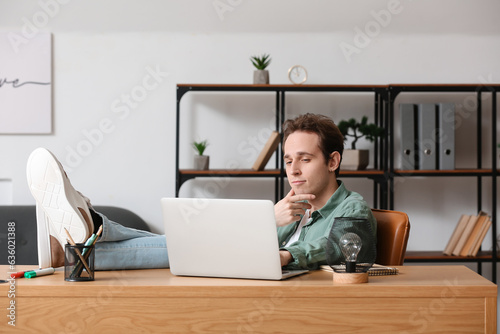 Male freelancer working wit...