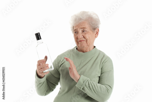 Senior woman rejecting bott...