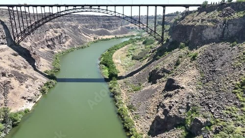 Drone footage showing Perrine Memorial Bridge on a river in Idaho on a sunny day photo