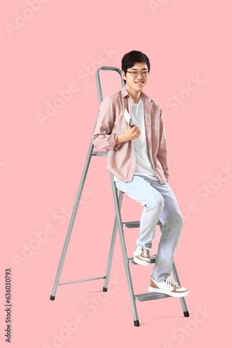 Young Asian man with putty ...