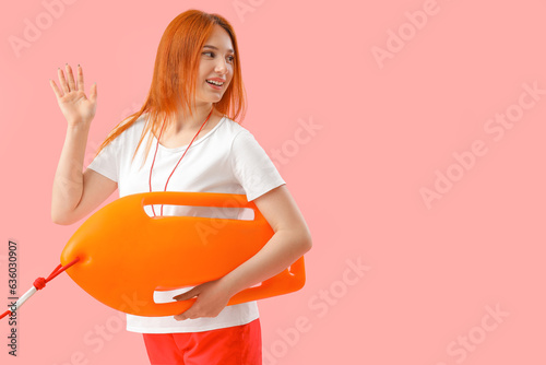 Female lifeguard with rescu...