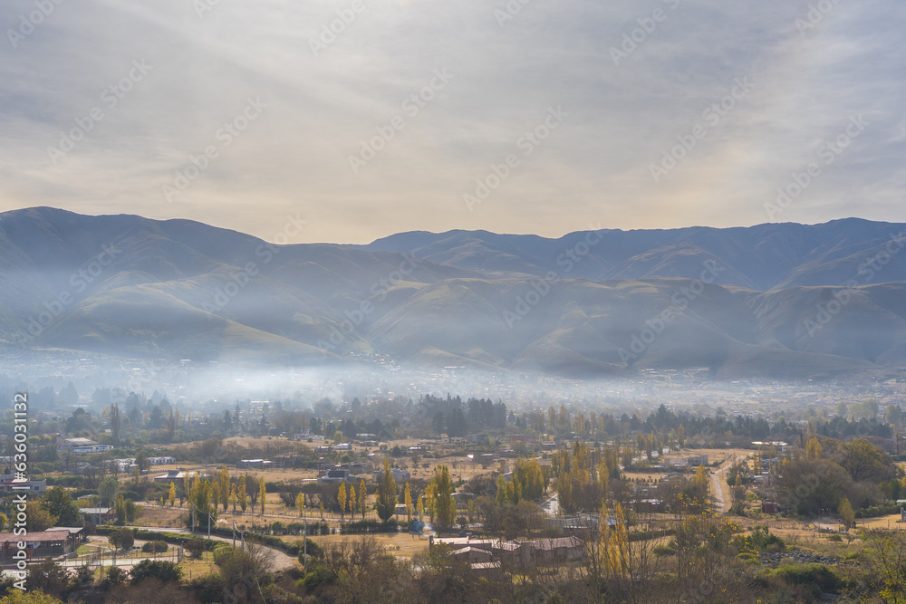 VIEW OF THE CITY OF TAFI DEL VALLE AT DAWN WITH FOG. CALCHAQUIES VALLEYS, TUCUMAN. ARGENTINA.