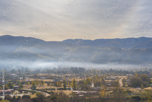 VIEW OF THE CITY OF TAFI DEL VALLE AT DAWN WITH FOG. CALCHAQUIES VALLEYS, TUCUMAN. ARGENTINA. photo