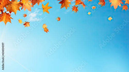 Autumn Leaves Falling Against Blue Sky