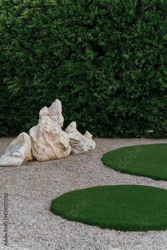 mid-century modern xeriscape landscape design with boulders photo