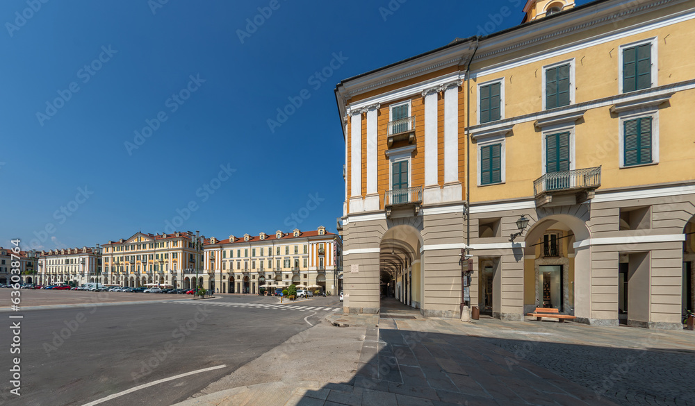 Cuneo, Piedmont, Italy - August 16, 2023: Piazza Tancredi Duccio GalimbertI, main square of Cuneo with historic neoclassical buildings, as seen from Via Roma