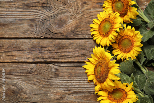 Fototapeta Naklejka Na Ścianę i Meble -  Beautiful sunflowers on wooden background