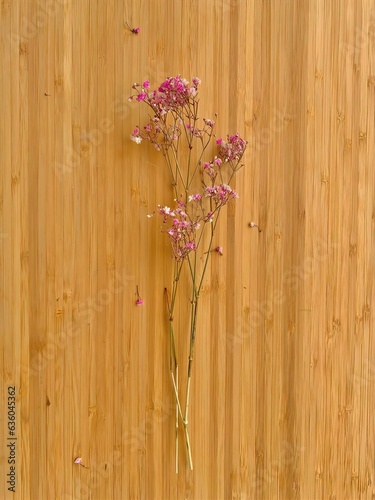 bunch of flowers on wooden background