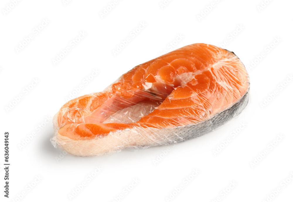 Fresh salmon steak in plastic food wrap on white background Fresh salmon steak in plastic food wrap on white background