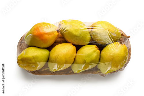 Fototapeta Naklejka Na Ścianę i Meble -  Wooden board of fresh pears covered with plastic food wrap on white background