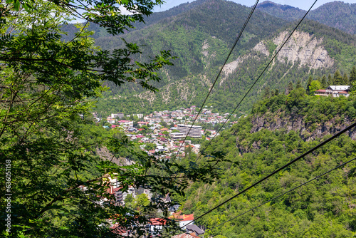Borjomi town aerial view seen from cable car above the city, resort town in green Borjomi Gorge, Borjomi-Kharagauli National Park, Caucasus, Georgia. photo