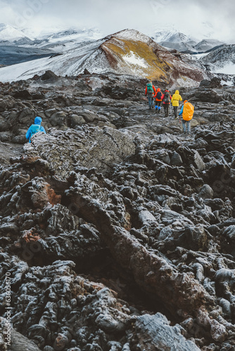 group of climbers walking on lava photo