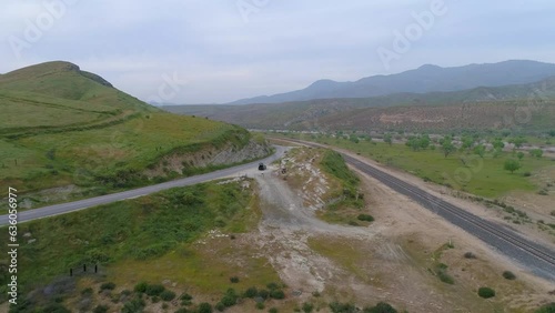 Wallpaper Mural Aerial Shot Of People By Cars On Road Near River, Drone Ascending Backward Over Landscape Against Sky - Bakersfield, California Torontodigital.ca