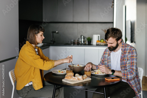 Couple eat food home apartment kitchen