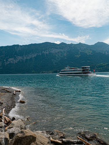 Ferry on thunersee switzerland with stunning view on mountainrange in switzerland Jungfaruregion Mountainlake photo