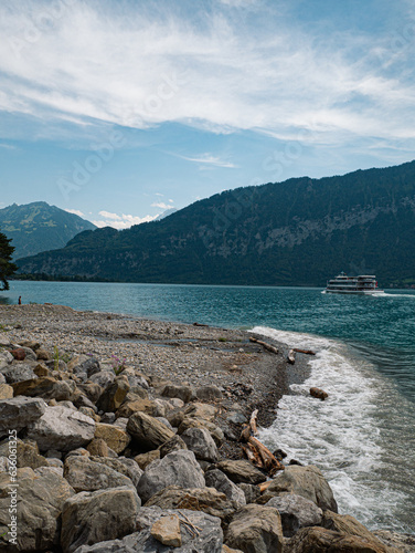 Berner Oberland Switzerland ferry passing by close to Jungfaruregion Mountainlake photo