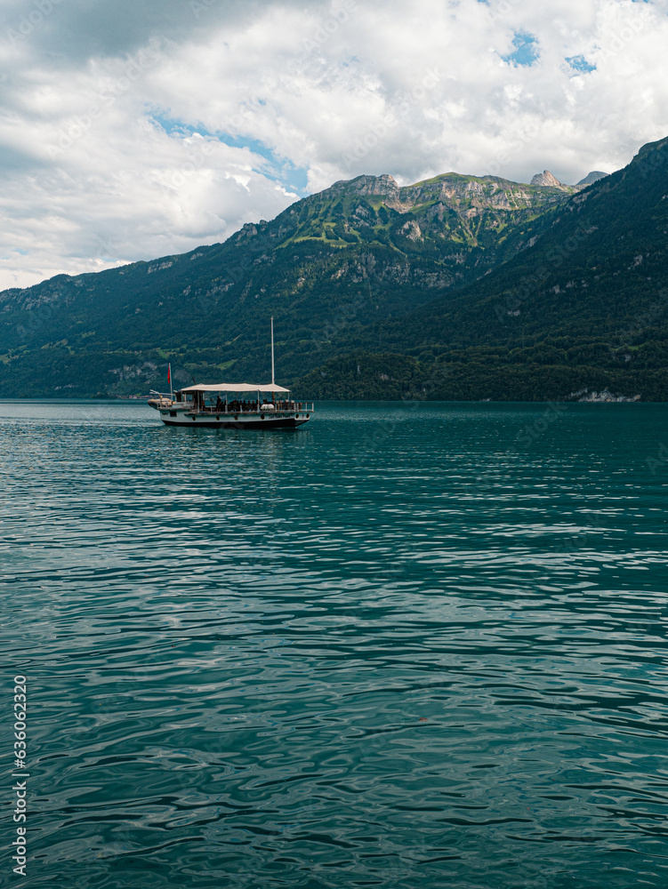Swiss ferry with Mountains in the back at Berner Oberland Switzerland Mountainlake