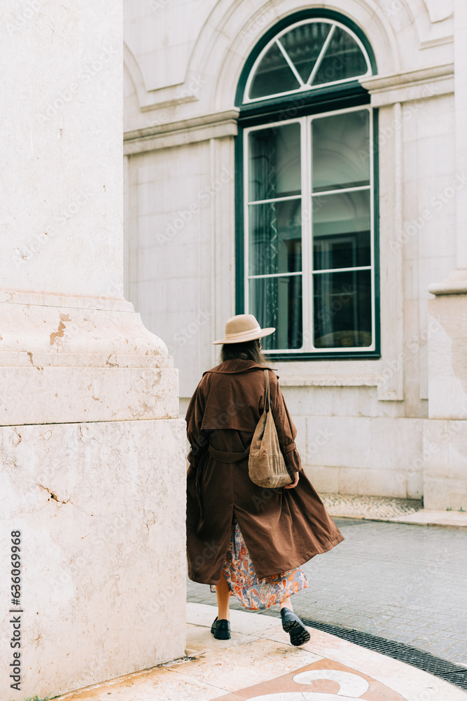 Anonymous woman walking away from camera Anonymous woman walking away from camera