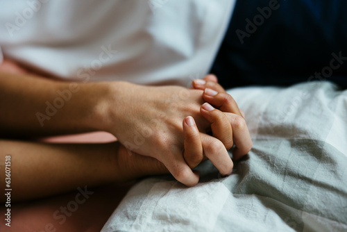 Crop couple holding hands photo