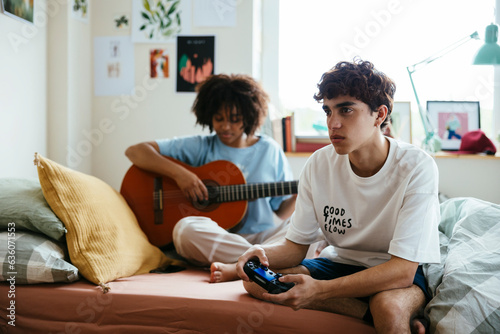Friends spending time in cozy bedroom