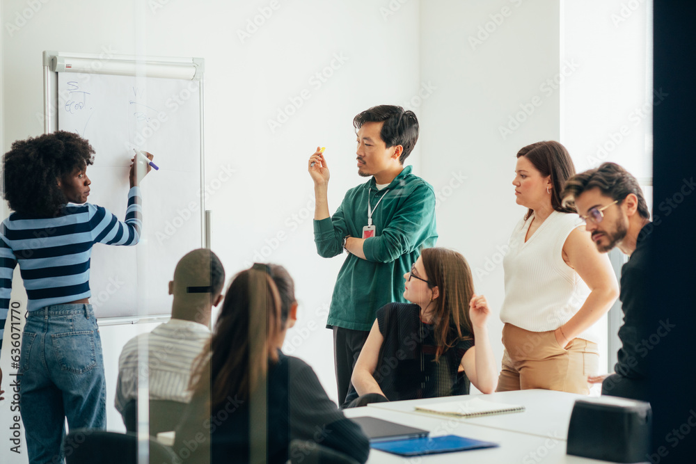 © Studio Firma/Stocksy - Business Meeting and Presentation