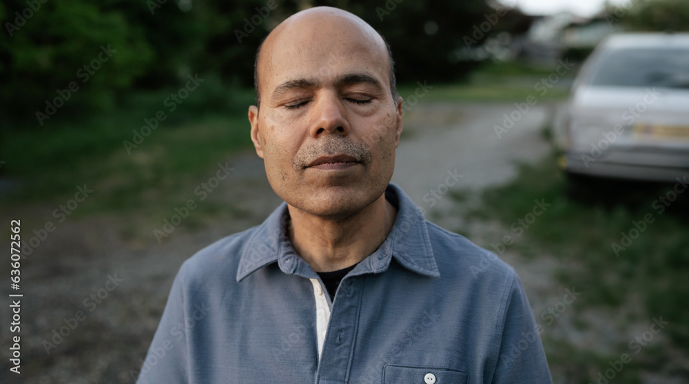 Meditative, serious portrait outside in the evening. Meditative, serious portrait outside in the evening.