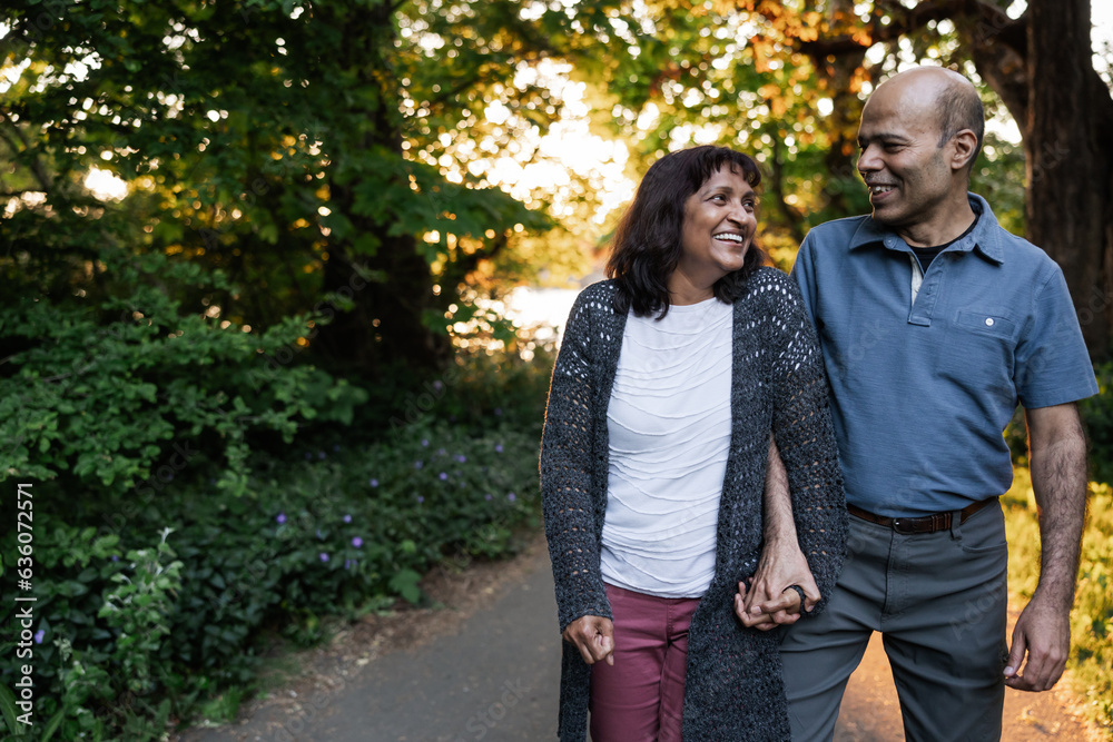 Playful couple enjoying evening walk together. Playful couple enjoying evening walk together.