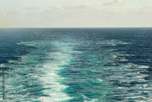 Ocean ripples from cruise ship propellers photo