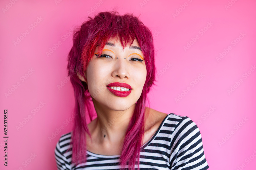Female hipster with red lip in pink studio