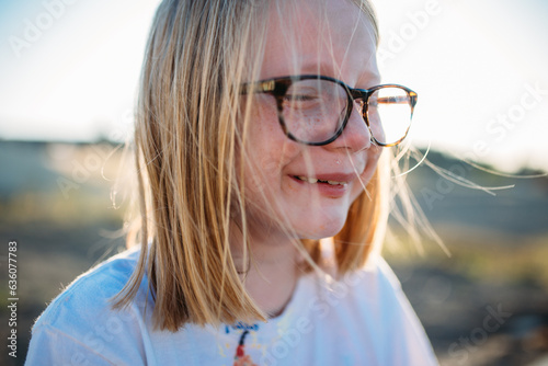 Close up portrait of young girl crying and laughing