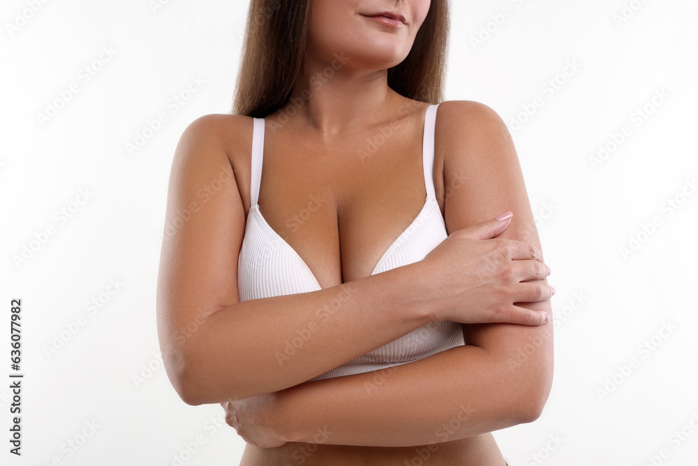 Fototapeta premium Woman with beautiful breast on white background, closeup