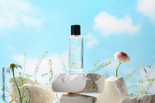 Glass perfume bottle on white podium