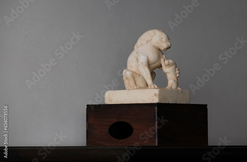 Stone lions carved with white marble for decoration at home photo