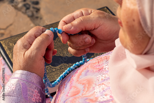 Grandmother holding sebha on Eid