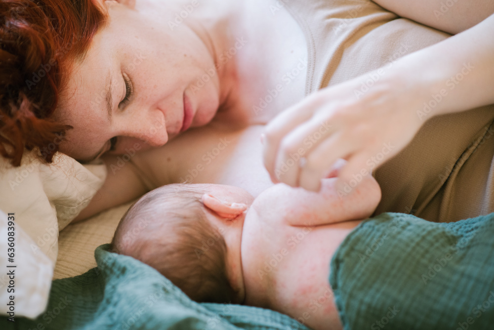 Young Mother Breastfeeds Her Baby. Young Mother Breastfeeds Her Baby.