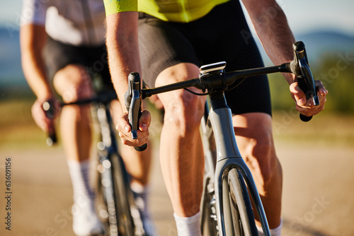 Racing cyclists crop of bicycle
