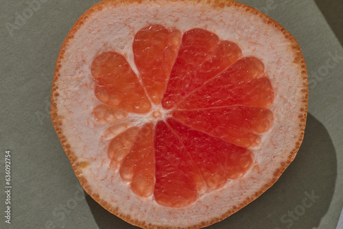 Slice of Grapefruit in Sunny Light with Hard Shadow photo