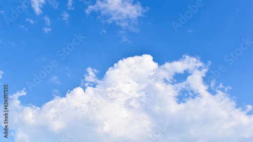 beautiful blue sky and white fluffy group of clouds with sunrise in the morning, natural background