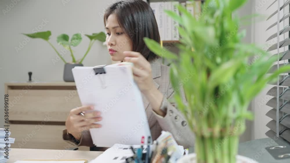 Young asian businesswoman working online internet research on laptop using computer at home office or apartment Young asian businesswoman working online internet research on laptop using computer at home office or apartment